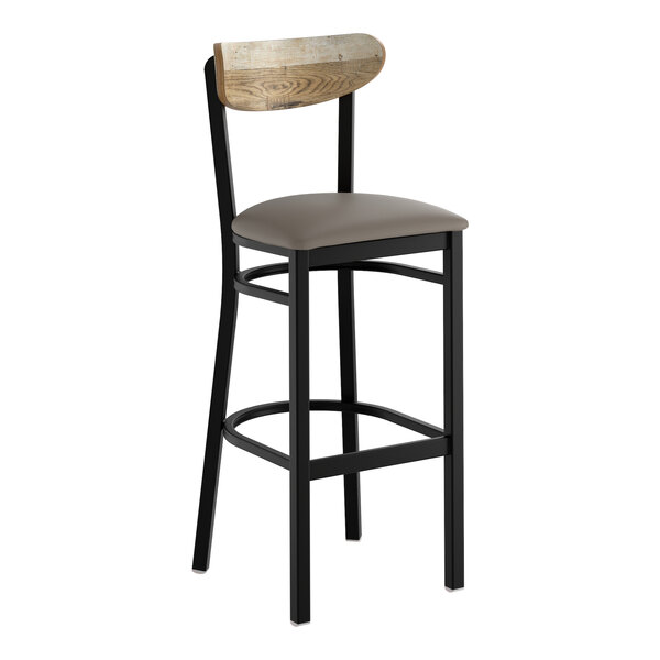 A bar stool with a black metal frame, dark gray vinyl seat, and a driftwood-finished wooden backrest.