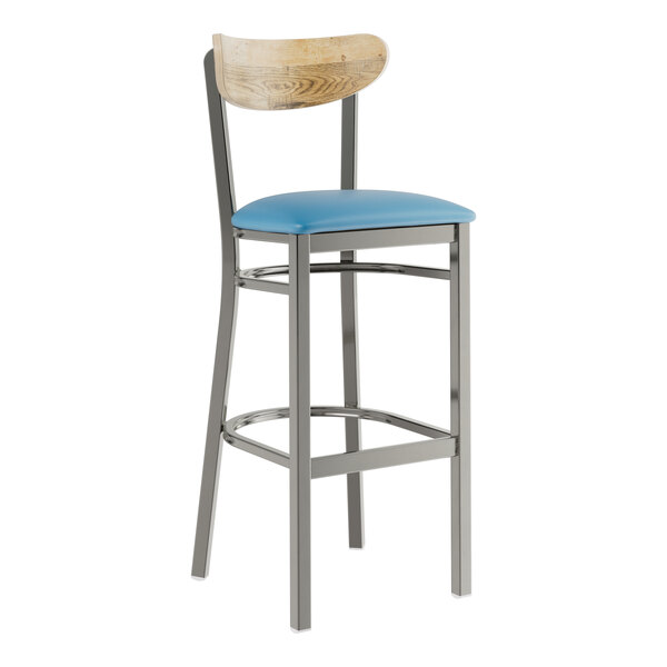 A Lancaster Table & Seating Boomerang bar stool with a blue vinyl seat and driftwood back and metal legs.