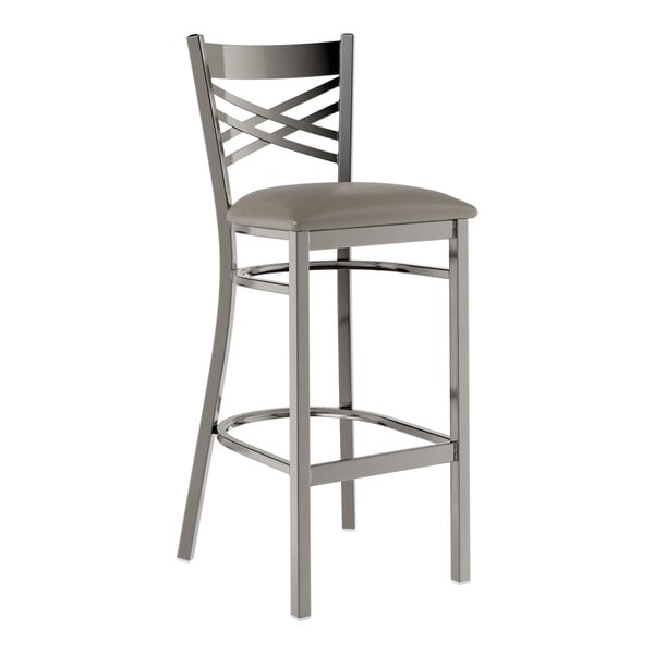 A Lancaster Table & Seating metal bar stool with a dark gray padded seat.