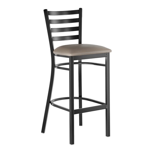 A black metal bar stool with a ladder back design and a dark gray vinyl padded seat.