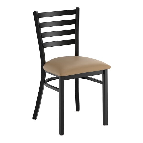 A black ladder back chair with a taupe vinyl padded seat.
