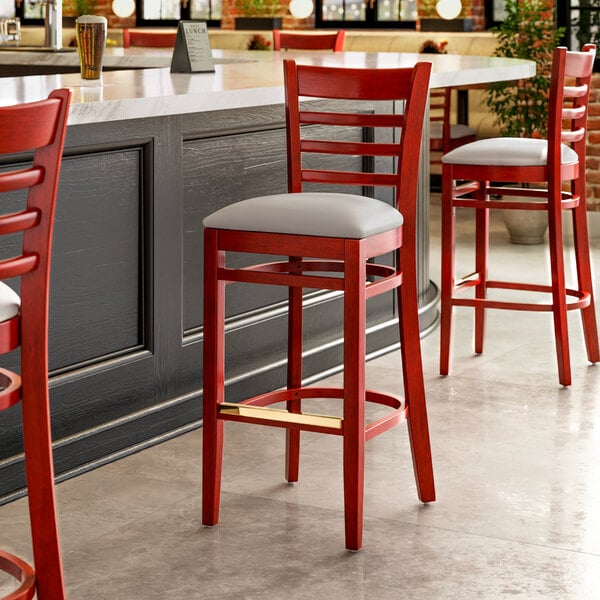 Lancaster Table & Seating Mahogany Finish Wood Ladder Back Bar Stool with Light Gray Vinyl Seat