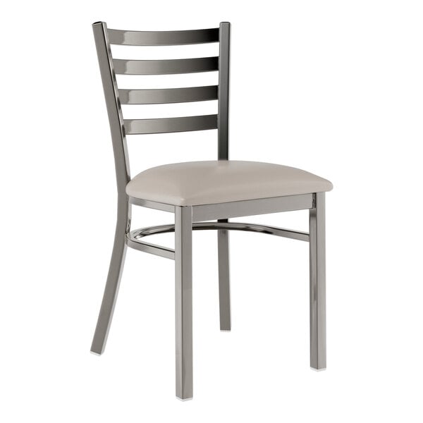 A Lancaster Table & Seating metal ladder back chair with a light gray cushion on the seat.