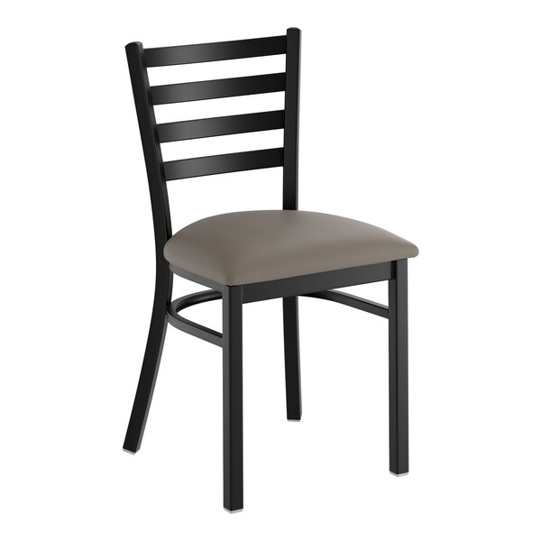 A black ladder back chair with a dark gray vinyl padded seat.