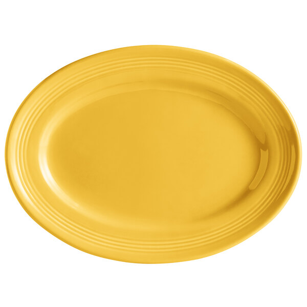 A yellow oval platter with a white background.