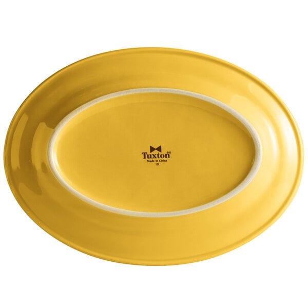 A yellow oval platter with a white rim.
