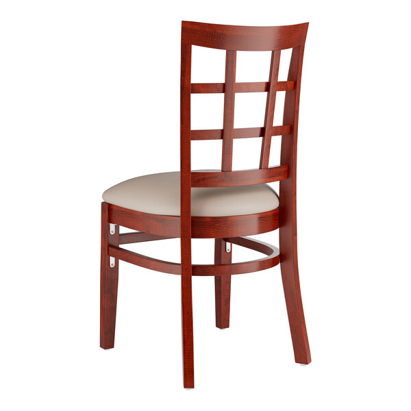 A Lancaster Table & Seating mahogany wood chair with a light gray cushion and back.