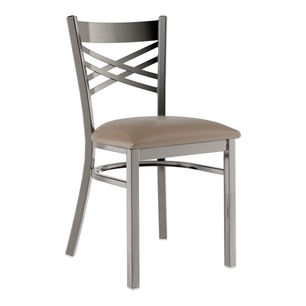 A Lancaster Table & Seating metal cross back dining chair with taupe vinyl cushion.