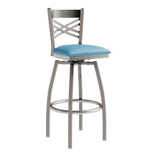 A Lancaster Table & Seating blue vinyl padded swivel bar stool with a clear coat and silver frame.