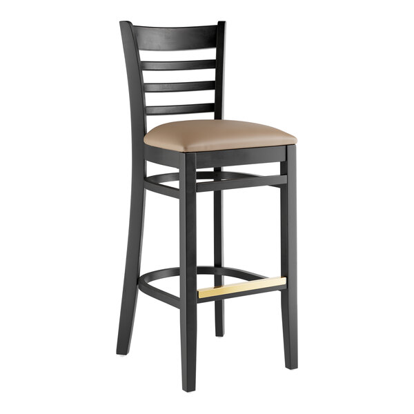 A Lancaster Table & Seating black wood bar stool with a taupe vinyl seat.