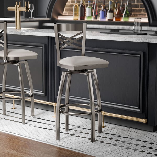Lancaster Table & Seating Clear Coat Finish Cross Back Swivel Bar Stool with 2 1/2" Light Gray Vinyl Padded Seat