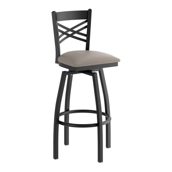 A black metal bar stool with a cross back design and a dark gray vinyl padded swivel seat.