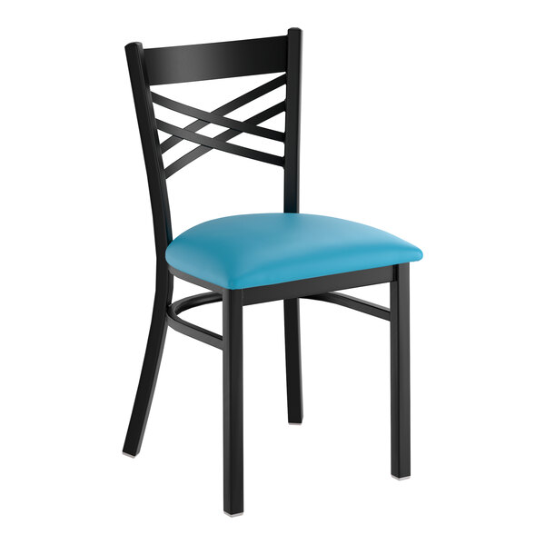 A black metal cross back chair with a blue vinyl padded seat.