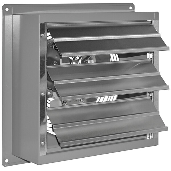 A stainless steel Canarm wall exhaust fan with three blades on a metal vent.