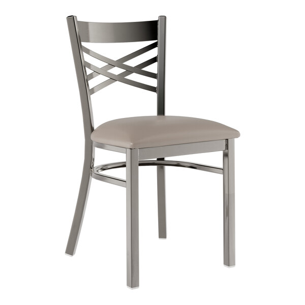 A Lancaster Table & Seating metal cross back chair with a dark gray cushioned seat.
