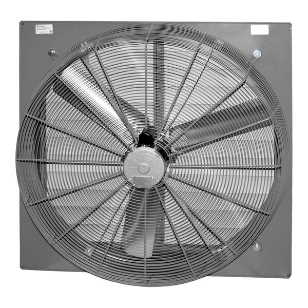 A large industrial wall-mounted exhaust fan with a protective metal grille and three visible blades.