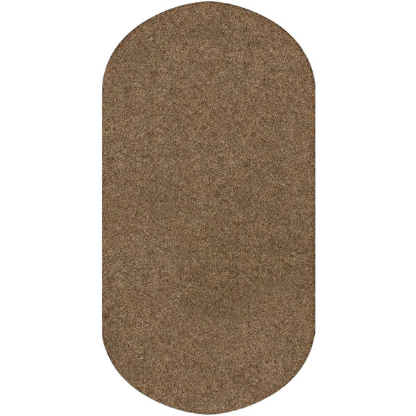 A tan oval WizKid antimicrobial mat.