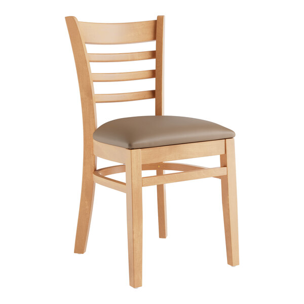 A Lancaster Table & Seating wooden restaurant chair with taupe vinyl seat and ladder back.