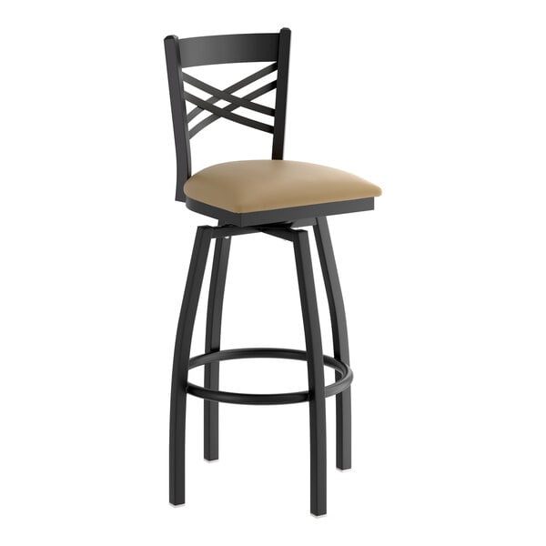 A black metal bar stool with a cross back design and a taupe vinyl padded swivel seat.