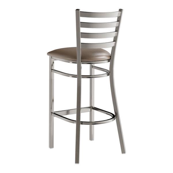 A Lancaster Table & Seating metal bar stool with a taupe vinyl padded seat.