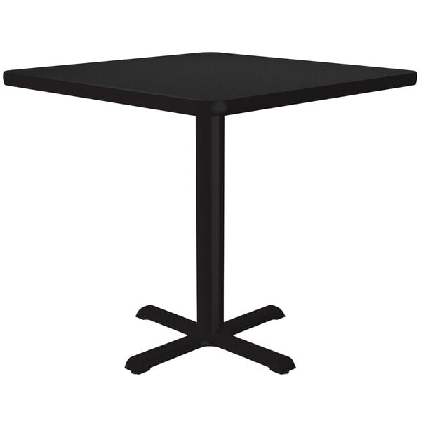 A Correll black granite square table with a metal base.