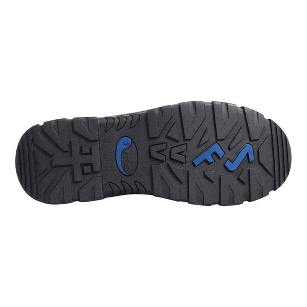 The image shows the black rubber outsole of a shoe with deep treads and blue accents.