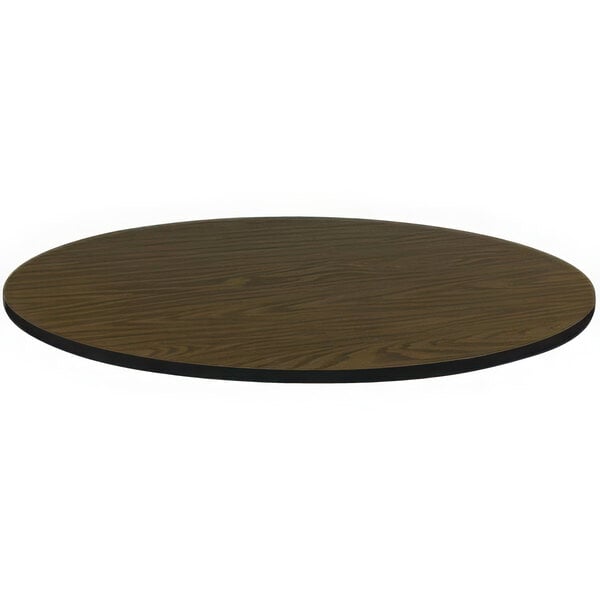 A brown Correll round table top with a black edge.