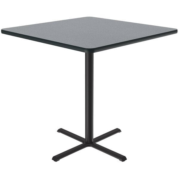 A Correll grey square bar height table with a black base.