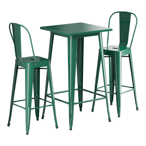 A Lancaster Table & Seating emerald green square table with silver legs and two barstools.