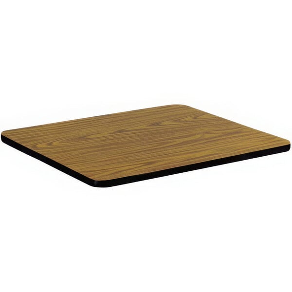 A medium oak square wood table top with a black edge.