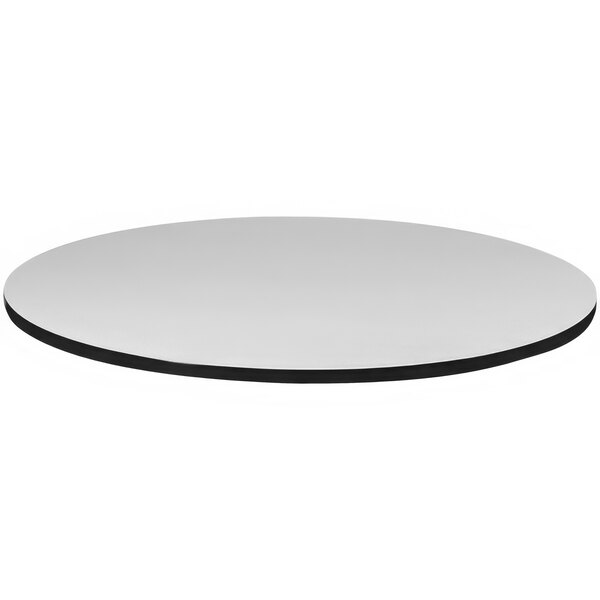 A Correll round gray granite laminate table top.