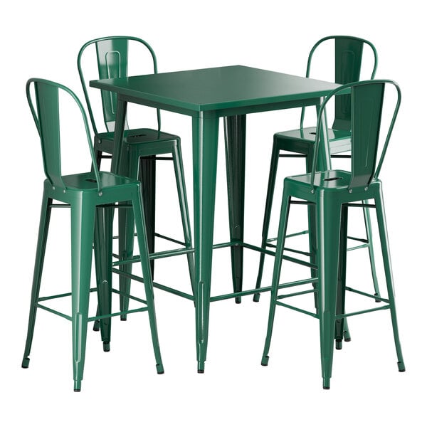A Lancaster Table & Seating green metal bar height table with four green metal bar stools.