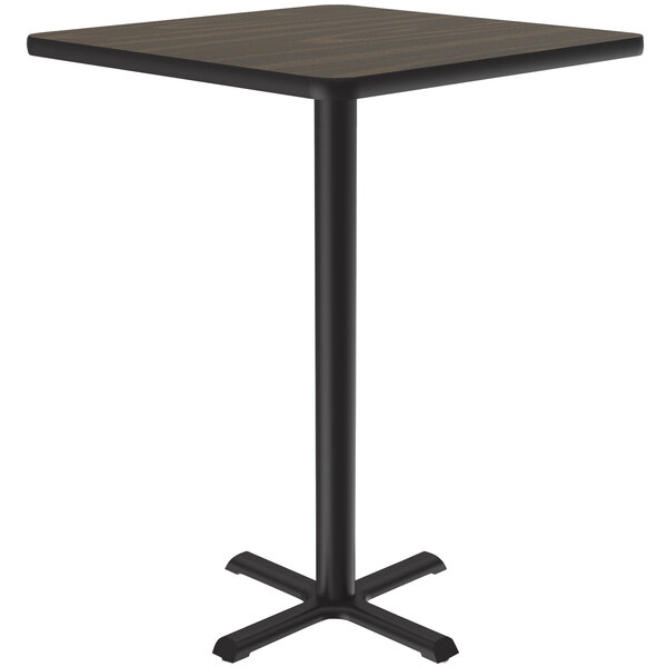 A Correll square bar height table with a walnut finish top and black base.