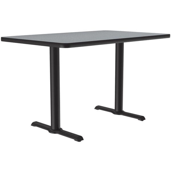 A rectangular gray granite Correll table with black T bases.