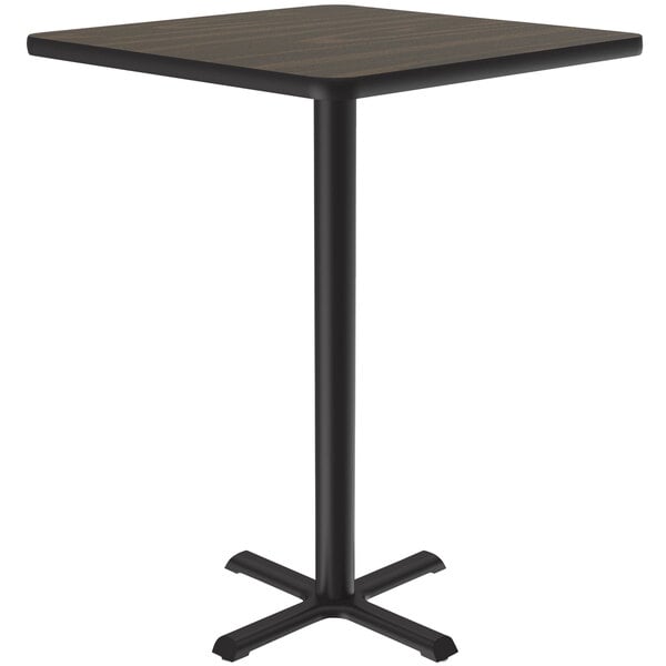 A Correll square table with a black base and a walnut finish top.