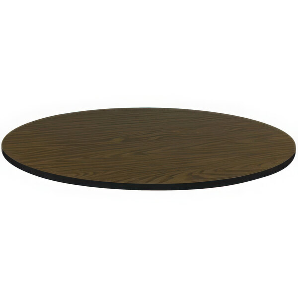 A brown Correll round table top with a black edge.