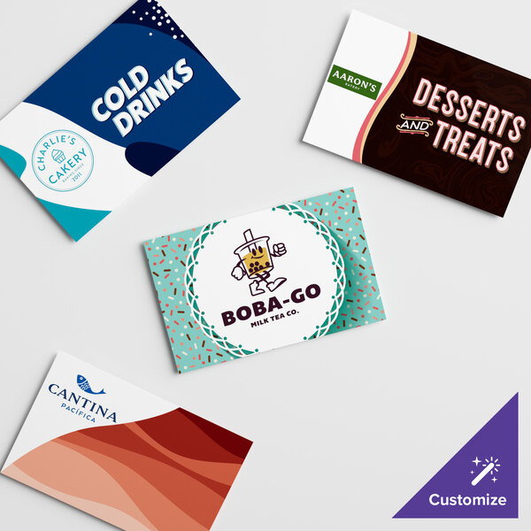 A white rectangular sign panel with brown and white business cards attached to it.