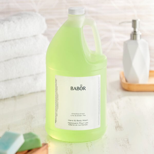 A white Babor bottle of green liquid with a white label.