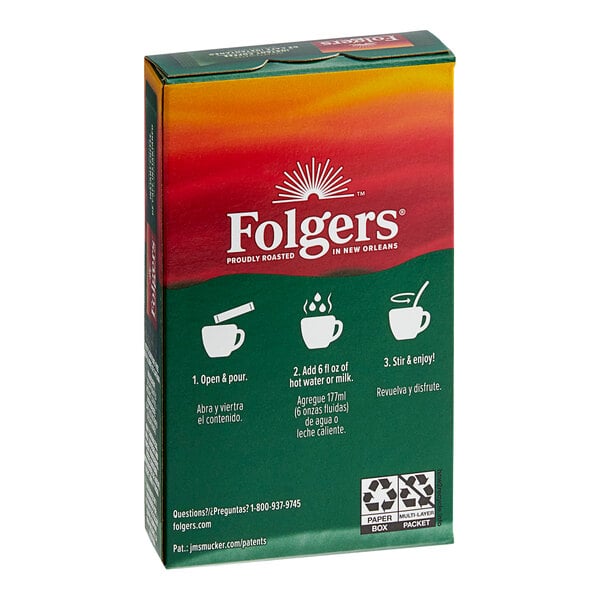 A green and red box of Folgers Classic Decaf Instant Coffee packets with white text.