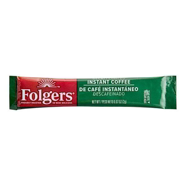 A green and red Folgers Classic Decaf Instant Coffee packet.