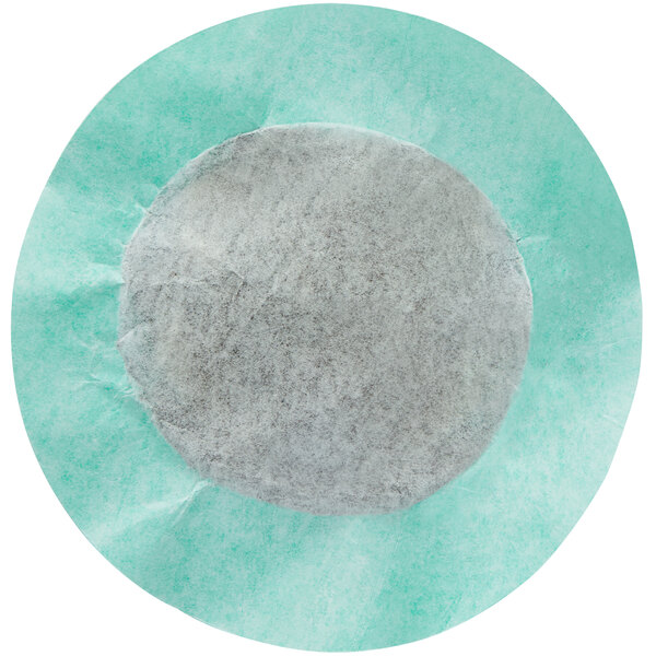 A round white coffee filter with a circle in the middle.
