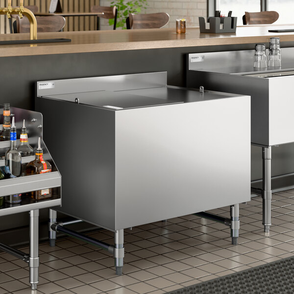 A stainless steel beer box with a lid and backsplash, designed for bar or restaurant use.
