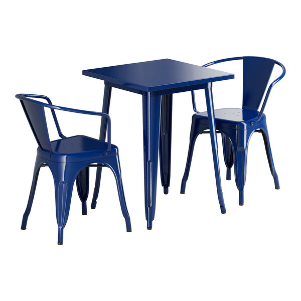 A blue square Lancaster Table & Seating outdoor table with two blue arm chairs.