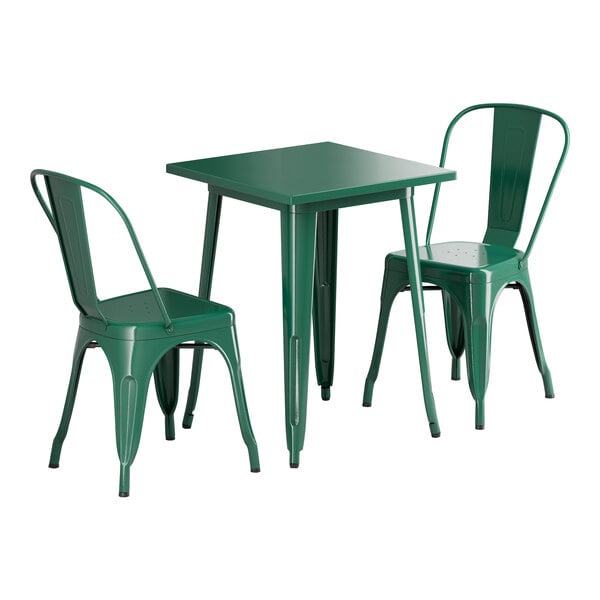 A Lancaster Table & Seating emerald green metal table with two chairs.