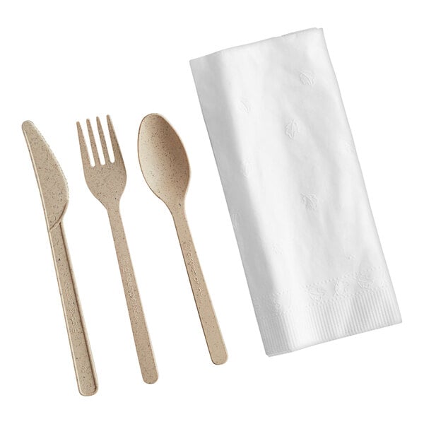 A Greenprint natural agave fork and spoon set wrapped in a white napkin.