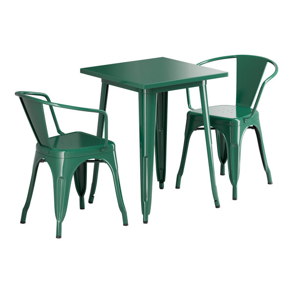 A green square table with two green chairs.