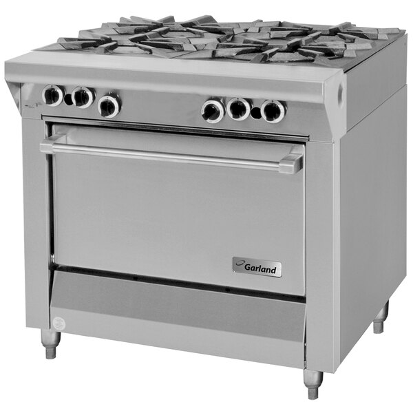 A stainless steel Garland Master Series liquid propane gas range with four burners on a counter in a professional kitchen.