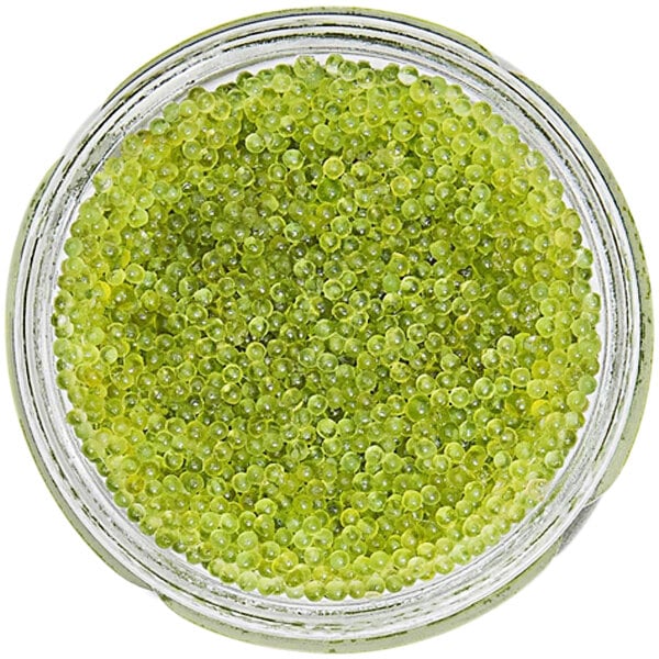 A jar of Bemka Green Tobiko with green spheres inside.