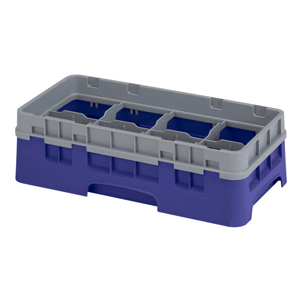 A navy blue plastic container with eight compartments and one extender.