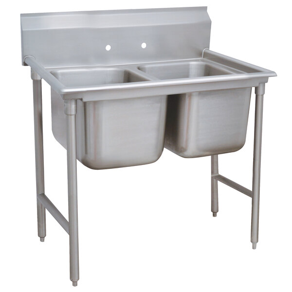 A stainless steel Advance Tabco two compartment sink with two bowls.